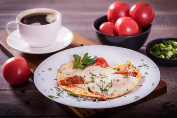 Fried eggs with green and vegetables. Helthy and delicious Breakfast.