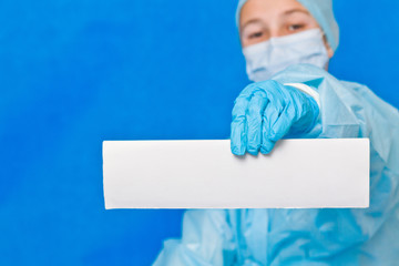 Young doctor showing white blank paper for writing any information