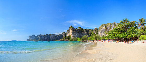 Turquoise crystal clear sea water with limestone cliff and mountain at Railay Beach, Krabi, Thailand