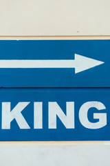 Unique image with the word "king" and a white directional arrow on a deep blue background.
