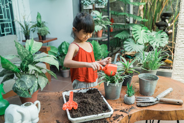 little girl gardening activity at home during holiday