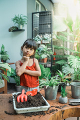 little girl gardening activity at home during holiday