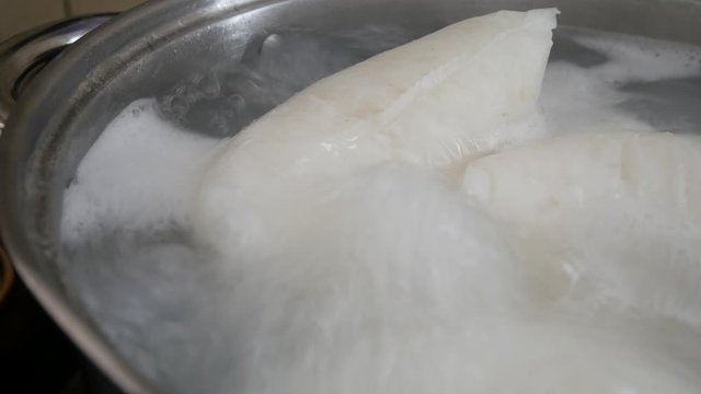 Nasi Impit or pressed rice in the plastic pack is boiled using hot water in a pan. Nasi Impit is usually cooked by Malay Muslims during Eid Celebration in Malaysia.