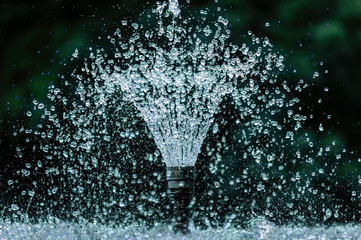 Obraz premium artesian fountain in park, in hot day