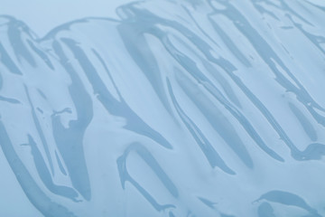 Sample of transparent cosmetic gel as background, closeup