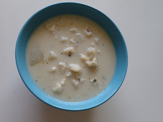 portion of a white cauliflower milk soup