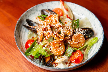 Fresh seafood salad, mussels, shrimp, fresh vegetables and herbs.