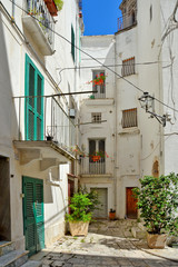 A narrow street in the old town of Monopoli in the Puglia region, Italy.