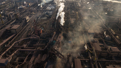 Steel ecology metallurgical iron plant smokes from pollution of industry pipes. View from the drone.