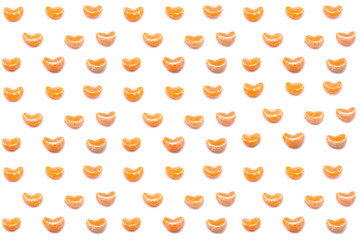 Mandarin slices on a white background. Seamless pattern. Tropical citrus background. Holiday, Christmas and New year concept