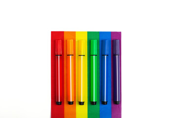 Mockup made with the LGBT pride flag and pencils. Concept of the Pride day, Valentine day, freedom, love. Flat lay, top view, template, overhead
