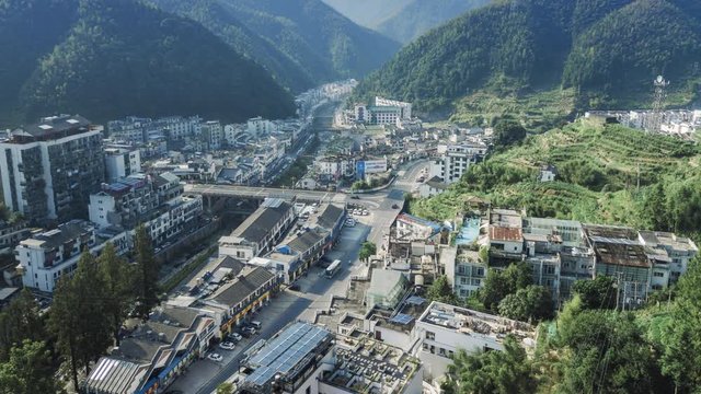 Aerial time lapse of a town in mountains of China