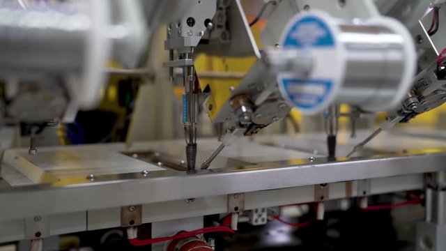Machine in a Chinese factory producing materials for medical equipment