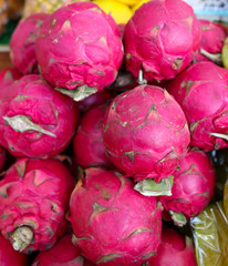 Dragon fruit on the counter at the market.