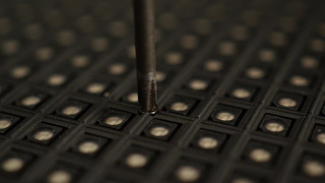 Manually screwing screw with hand and screwdriver.