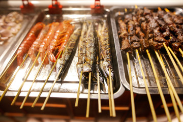 Fish on skewers for frying on the grill.