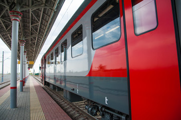 Red train in modern railway