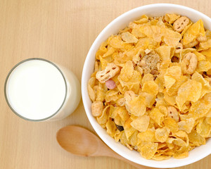 cereal in a white bowl on wooden background. Healthy breakfast concept.