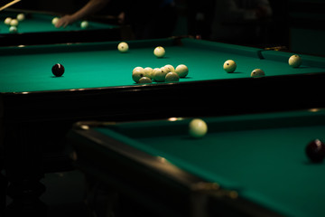 Sports game of billiards on a green cloth