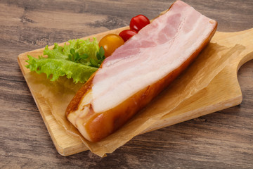 Smoked pork breast with salad leaves