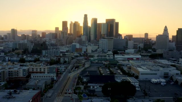 4K Aerial Of Empty Downtown LA Skyline Silhouette At Sunset During The COVID-19 Outbreak.