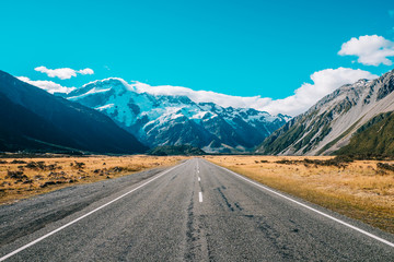 road leading to mountain with snow 