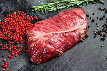 Top blade steak, raw meat, marbled beef . Black background. Top view