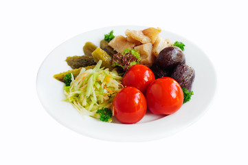 Pickled vegetables - cucumber, tomato and cabbage isolated on white. Preserved food