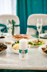 White candle on the wedding table