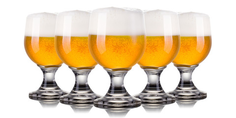 Set of frosty glasses of light beer with foam isolated on a white background