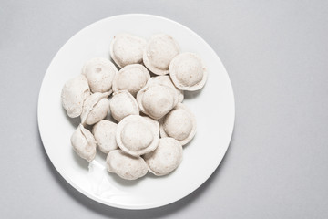Frozen dumplings with turkey meat in porcelain plate