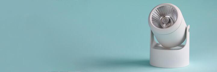 Close-up of electric white lamp. Indoor or outdoor decorative element. Energy saving light bulb, led lamp, spotlight. Repair and maintenance of electrical equipment concept