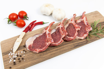 The white background is fresh lamb ribs on the serving table
