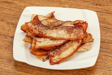 Roasted juicy bacon in the plate