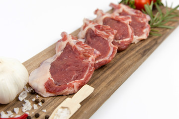 The white background is fresh lamb ribs on the serving table
