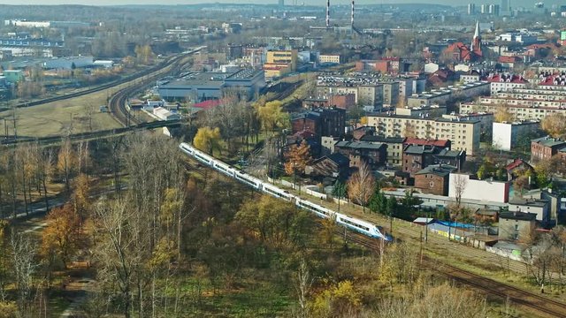 Passenger Train Ride On a City View - AERIAL