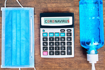coronavirus epidemic, debt and financial problem ,bankrupcy concept with calculator, protective...