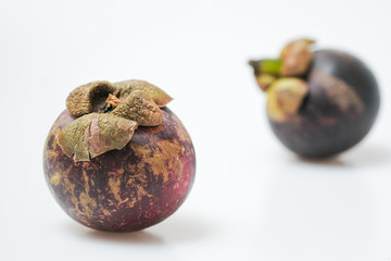 Close-Up Of Mangosteen Fruits On Table