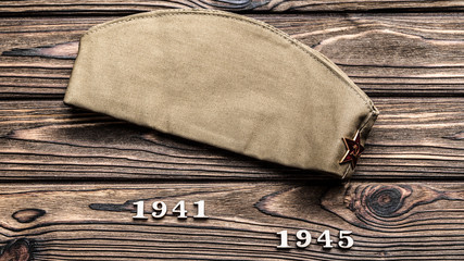 a pilot's coat from the time of the Second World War, figures that signify the war years on a...