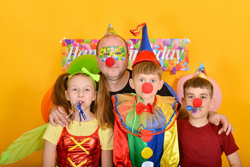Dad celebrates a birthday with fairy clowns.