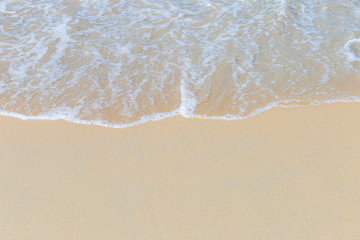 Fototapeta na wymiar White wave on fine sand beach, nature concept background, clean beach, environmental friendly, summer outdoor day light