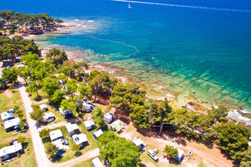 Camping by the sea and crystal clear stone beach aerial view in Savudrija