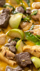 A vetical Queen of food  a Thai Spicy Green Curry with Chicken in the kitchen, Till and down