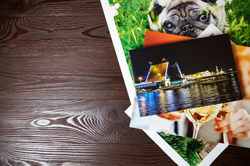Canvas prints on brown wooden background with copy space. Photos with gallery wrap