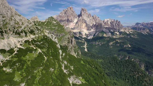 Cristallo mountain and landscape in the Dolomites, panoramic forward aerial