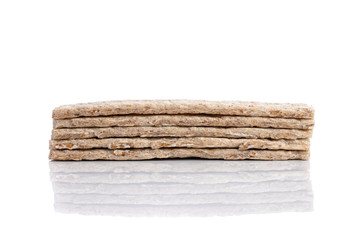 Stack of grain crisp bread isolated on a white background.