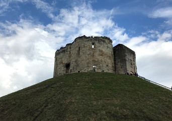 Fototapeta na wymiar Clifford's Tower with Blue Skies and Clouds