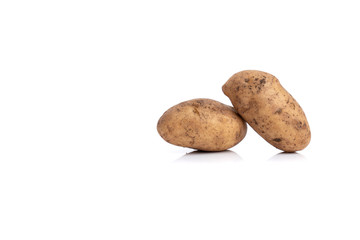 Fototapeta na wymiar Two potato tubers isolated on a white background. Potatoes close-up.