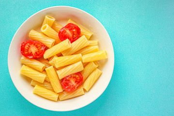 pasta tomatoes ready to eat healthy food Tortiglioni and tomato sauce (Italian main course Maccheroni, Rigatoni) menu concept. food background. top view. copy space for text