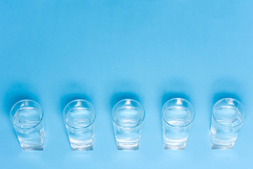 top of view of drink glasses with water, nutrition and health-care concept, nutrition and health-care concept on white background